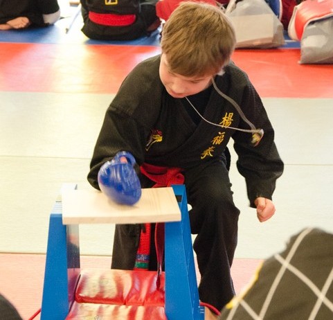 best kids birthday party ideas- fun martial arts- board breaking